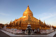 Shwezigon pagoda in Bagan, Myanmar, sunlit at sunset