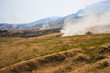Smoke from grass burning near Mount Aso, Japan Smoke from grass burning near Mount Aso, Japan