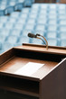 Speaker's table with paper, your text possible