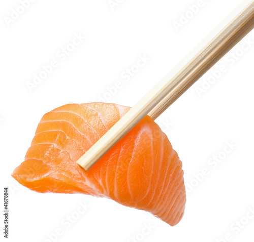 Photo: Chopsticks with sliced raw salmon Chopsticks with sliced raw salmon