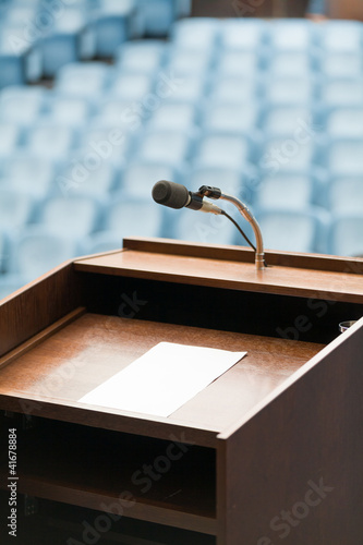 Photo: Speaker's table with paper, your text possible Speaker's table with paper, your text possible
