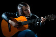Woman Playing Classical Guitar in a Concert