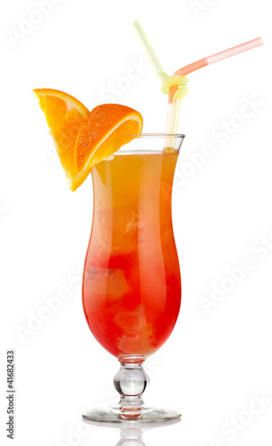 Photo: Orange alcohol cocktail with fruit slices isolated Orange alcohol cocktail with fruit slices isolated