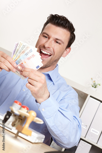 Foto: Manager mit Geldfächer Manager mit Geldfächer
