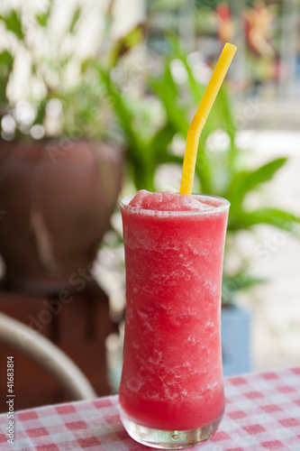 Photo: Red watermelon Juice in green garden Red watermelon Juice in green garden