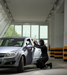 A thief trying to steal a car