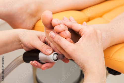 Photo: pedicure in a beauty salon pedicure in a beauty salon