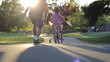 Excited Father Helps Daughter Ride Her New Bike Up Hill