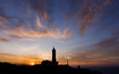 Puesta de sol y faro.
