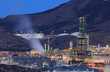 Oil refinery facilities illuminated at night Oil refinery facilities illuminated at night