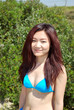 Portrait of Asian girl with bikini in the  forest