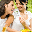 Young happy couple at picnic, outdoors Young happy couple at picnic, outdoors