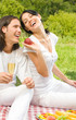 Young happy couple at picnic, outdoors Young happy couple at picnic, outdoors