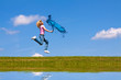 Woman jumps on the meadow