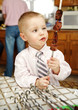 Little boy eats shish kebab