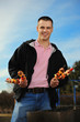Young man has control over a shish kebab