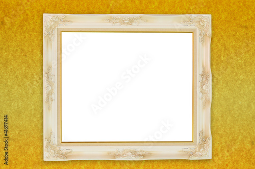 Photo: Old antique frame over gold paper background Old antique frame over gold paper background