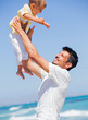 Father and son having fun on beach Father and son having fun on beach