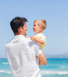 Father and son having fun on beach Father and son having fun on beach