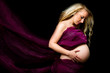 Young pregnant mother with her belly