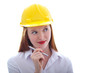 Long haired red headed woman holding a pen and wearing a safety