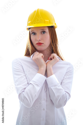 Photo: Long haired happy girl with yellow helmet looking to us Long haired happy girl with yellow helmet looking to us