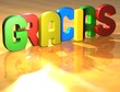Word Gracias on yellow background