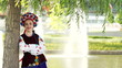 Ukrainian girl near a tree in the park Donbass Arena. Ukraine.