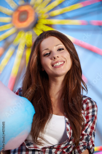Photo: Smiling woman in amusement park. Smiling woman in amusement park.