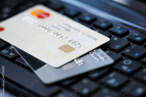 Photo: Credit cards on a keyboard Credit cards on a keyboard