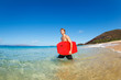 Young Man with Boogie Board at the Beach