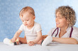 Female doctor and baby patient.