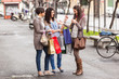 Three Beautiful Young Women with Shopping Bags Three Beautiful Young Women with Shopping Bags