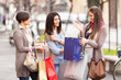Three Beautiful Young Women with Shopping Bags Three Beautiful Young Women with Shopping Bags
