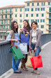 Three Beautiful Young Women with Shopping Bags Three Beautiful Young Women with Shopping Bags