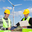 Two Engineers in a Wind Turbine Power Station Two Engineers in a Wind Turbine Power Station