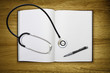 stethoscope open blank book