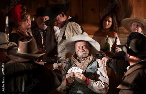 Foto: Happy Gambler Holds Winning Cards Happy Gambler Holds Winning Cards