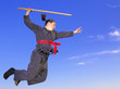 Woman ninja in an aggressive posture flying with katana