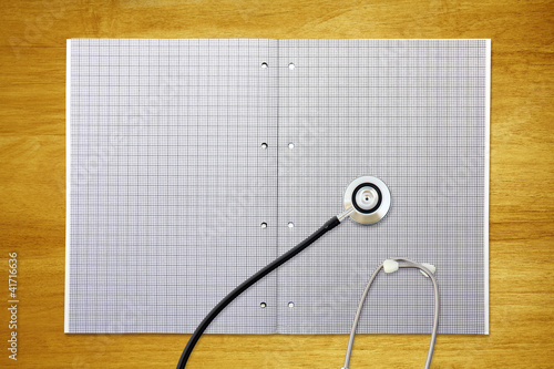 Photo: stethoscope on graph paper stethoscope on graph paper