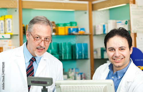 Photo: Portrait of two pharmacists in a store Portrait of two pharmacists in a store