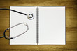 stethoscope on blank notepad