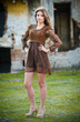 Attractive young woman posing outdoor in the field