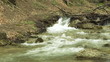 Rapid river with small waterfalls.