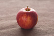 apple lying on brown mat