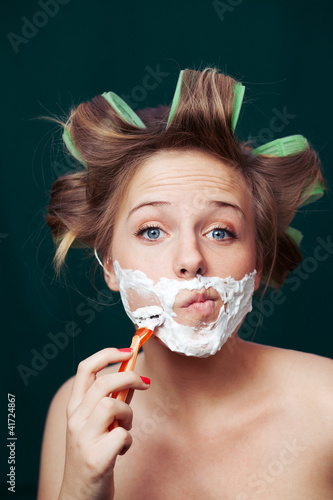 Photo: Girl shaving face Girl shaving face