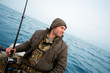 Photo: Angler catches a salmon trolling Angler catches a salmon trolling