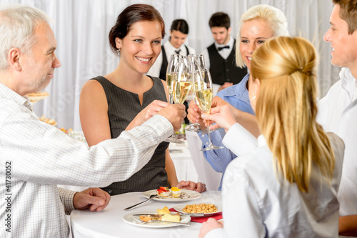 Photo: Business partners toast champagne company event Business partners toast champagne company event