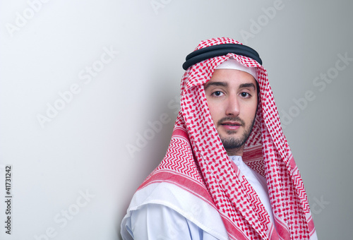 Photo: Portrait of a handsome young arabian business man leaning Portrait of a handsome young arabian business man leaning
