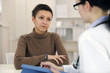 Psychologist and depressed patient at office